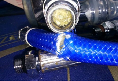 Figure 11 - Severely degraded TPU hose clogging air hose.